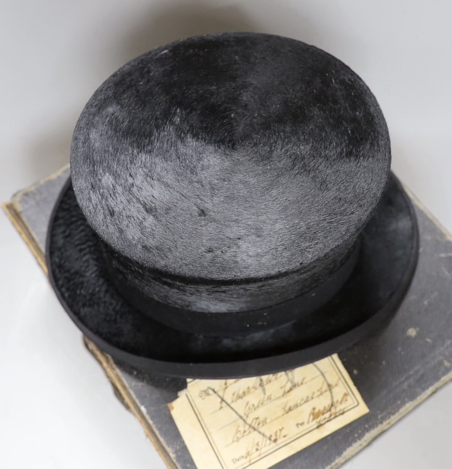 A boxed gentleman's black top hat, by Royal appointment: Woodrow, 45 Gordon St. Glasgow